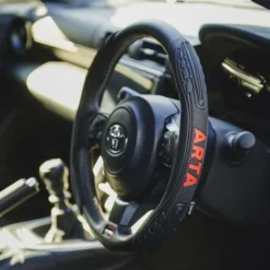 COUVRE-VOLANT PART NOIR/ROUGE - ARTA